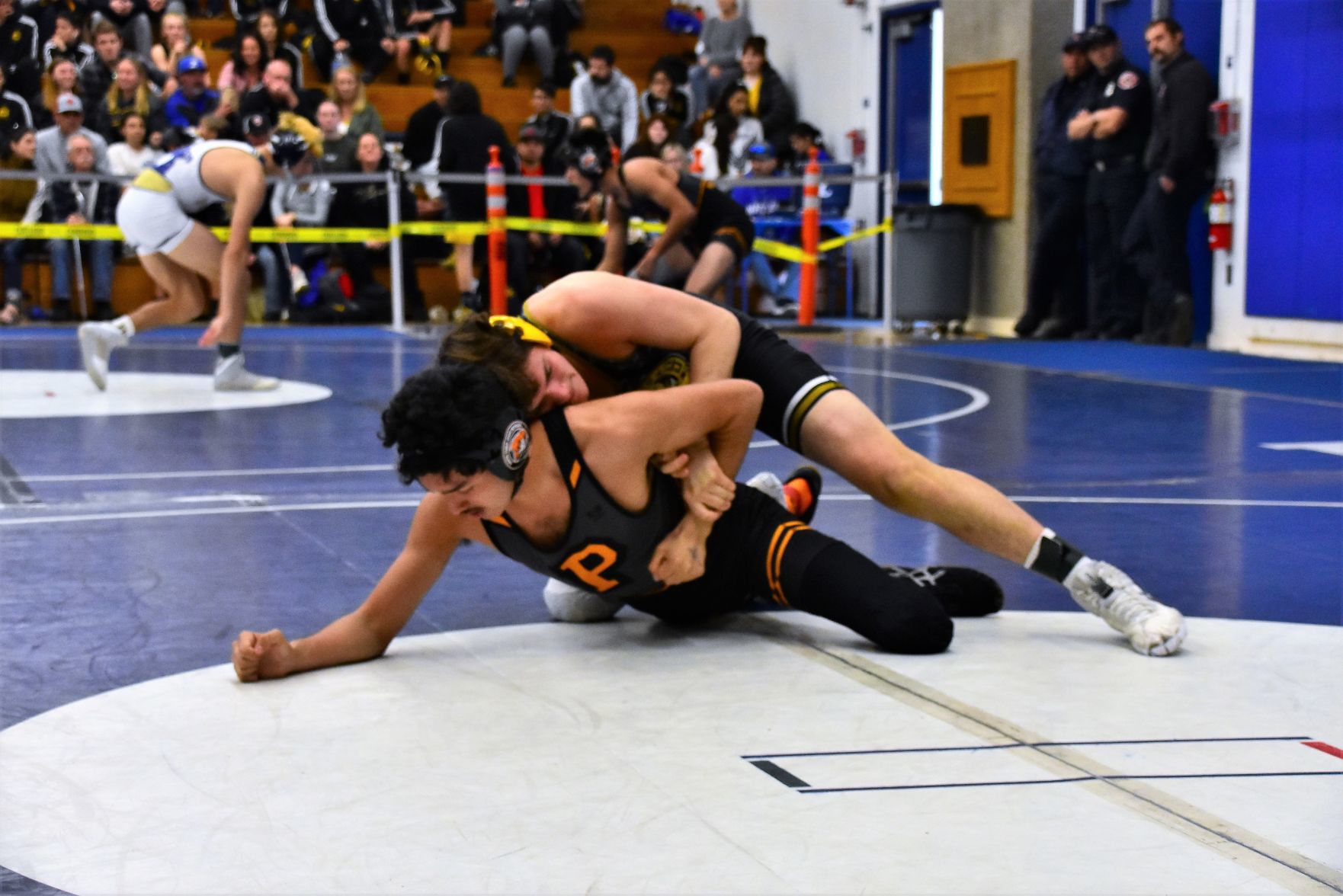 Cabrillo's Blake Rehder (Top) works to control Santa Ynez Freddy Lemmex